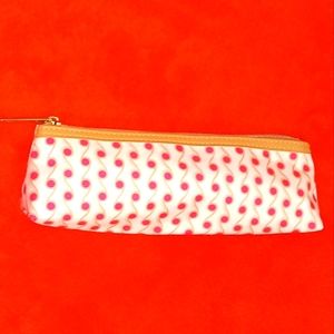 Orange little Estee Lauder pouch